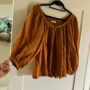 Doen button up top. Size small. Worn once. ochre color.
